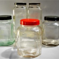 Group of 1920s Glass Jars with Bakelite lids Red and Green - Sold for $25 - 2018