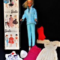 Vintage BOXED 1960's BARBIE DOLL - Blonde, w Protruding Eyebrows & Original Earrings w some blackening behind ears, w Spare Clothes & access - Sold for $68 - 2018