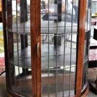 Bow fronted Tasmanian oak leadlight display cabinet - Sold for $75 - 2018