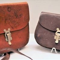 2 x leather tramway bags engraved 'JLT' on metal clasp - Sold for $56 - 2018