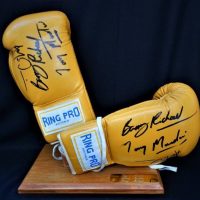 Pair of Boxing Gloves signed by Tony Mundine, Anthony Mundine and Barry Michael - Sold for $124 - 2018