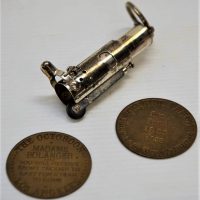 small lot - 2 x Vintage Brass BROTHAL TOKENS w Embossed text THE OCTOROON Los Angeles & THE HOG RANCH Fort Laramie + Wind Proof Fuel CIGARETTE Lighter - Sold for $81 - 2018