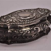 1904 Sterling silver box decorated with embossed foliate decoration and c scrolls Hallmarked for Birmingham - Sold for $68 - 2018