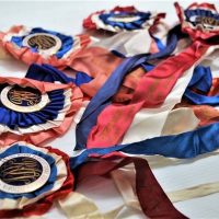 5 x 1940s - 50s The Royal Agricultural Society of Victoria, rosettes ribbons with enamel Stokes badges to centre of each Two ribbons marked Champion F - Sold for $43 - 2018