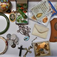 Box lot incl Oriental jewellery, green stone earrings, pendants, bangles, Religious rosary beads, St Christopher's, souvenirs, Lourdes, etc - Sold for $50 - 2018