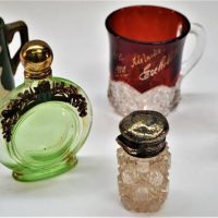 Group with sterling silver topped cut crystal bottle, 1910 ruby flash exhibition mug and green glass perfume bottle - Sold for $56 - 2018