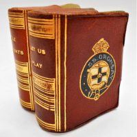 Twin playing card set with Crest of the SS Oronsay in a miniature leather bound book shaped cover - Sold for $37 - 2018