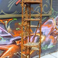 Victorian 7 tiered WOT NOT- spotted canebamboo frame with curled wcker decoration and wallpapered circular shelves - Sold for $261 - 2018