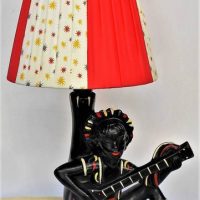 1950s black Barsony lamp - seated boy playing guitar with red panelled shade - Sold for $273 - 2019