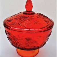 2 pieces of Vintage American Amberina glass including lidded candy dish, footed with embossed grape and vine pattern - 19cms H - Sold for $35 - 2019