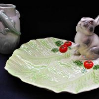 2 x vintage Australian Pottery items inc, Wembley Ware grey rabbit on a green leaf lustre dish approx 16cm H and a Huntley Ware vase with raised twin  - Sold for $62 - 2019