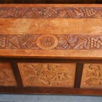 Hand carved Blanket box with grape and vine panels Front sides and top signed DS 1919 - Sold for $149 - 2019