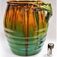 Large Remued Australian Pottery vase with branch handle in Brown and green drip glaze 22cm tall hairline crack to base - Sold for $112 - 2019