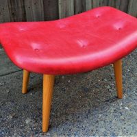 Modern Grant Featherston contour foot stool, upholstered in read leather - Sold for $75 - 2019