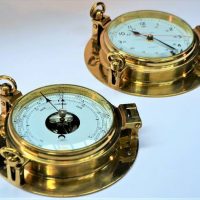 Pair of Ships brass porthole Clock and Barometer with 15cm diameter dials - Sold for $161 - 2019