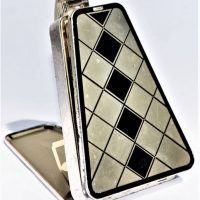 1930s Art Deco American triangular chrome and enamelled Vanity Necessaire Compact with double sided gilt interior and silver-plated mesh strap mirror  - Sold for $161 - 2019