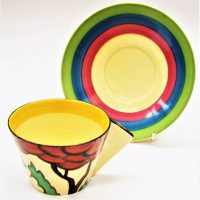 Art Deco Clarice Cliff cup and saucer Fantasque Bizarre Cup with triangle handle (tiny chip to rim) - Sold for $87 - 2019