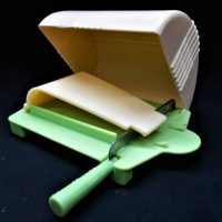 Art Deco cream and green Bakelite cheese dish  cutter,  marked Craftmaster Mandon Pty Ltd - Sold for $75 - 2019