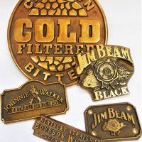 Group lot - Brass advertising plaques for Jim Beam, Johnnie Walker and Carlton Cold etc - Sold for $31 - 2019
