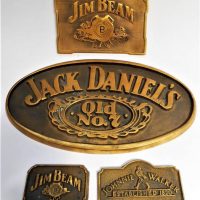 Group lot - Brass advertising plaques for Jim Beam, Johnnie Walker and Jack Daniels etc - Sold for $43 - 2019