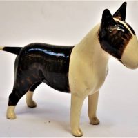 Post War Australian pottery Kalmar 'Bull Terrier' figure - cream and brindle, approx 25cm long - restoration to ear, signed under belly - Sold for $43 - 2019