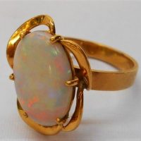 Ladies 18k Gold ring with solid white Opal 83 grams - Sold for $900 - 2019