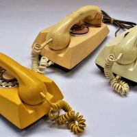 3 x Vintage rotary dial wall phones yellow, white and brown - Sold for $68 - 2019