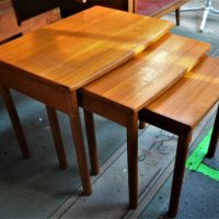 Nest of 3 Teak Mid Century modern Parker style coffee tables with round legs - Sold for $50 - 2019