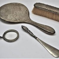Group of Sterling silver vanity items including shoe horn, mirror, brush etc - Sold for $68 - 2019