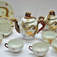 Japanese porcelain with Dragon spouts and finials with Transparent Geisha head base cups - Sold for $137 - 2019