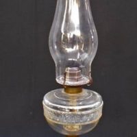 C1900 Oil lamp with decorative cast iron base - Sold for $31 - 2019