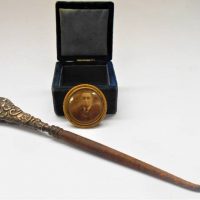 Group lot - small square Victorian jewellery box with embossed silver work & image of woman to lid, button hook with hallmarked embossed handle, gilt  - Sold for $35 - 2019