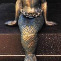 Heavy Modern cast iron seated mermaid figurine - Sold for $161 - 2019