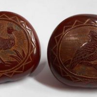 Pair c1900 carved sea heart buttons with twin metal shanks - featuring Emu and Kookaburra - Sold for $161 - 2019