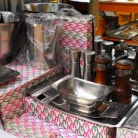 Group of 1970s Wiltshire Burgundy Stainless steel items including Boxed Trays, cheeseboard, Butter dish, 4 Piece coffee set etc - Sold for $68 - 2019