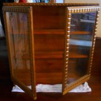 Vintage timber glazed 2 door cabinet - approx 80cm tall - Sold for $35 - 2019