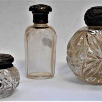 3 x Crystal dressing table bottles with sterling silver tops and collars - Sold for $56 - 2019