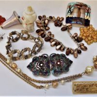 Group lot vintage items - Art Nouveau enamel buckles, pale lavender enamel light switch, white glass dog shape perfume bottles, 1960s necklaces, brace - Sold for $81 - 2019