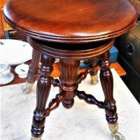 Wooden piano stool with claw and ball feet - Sold for $35 - 2019
