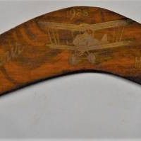 Small boomerang with gilded deocration - Souvenir of Bert Hinkler's 1923 Great flightfeat his Biplane - Sold for $31 - 2019