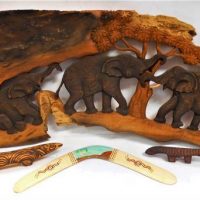 Group lot wooden carvings and other tribal items incl boomerang, elephant wall sculpture, etc - Sold for $43 - 2019