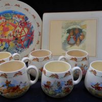 Group of Royal Doulton Bunnykins mugs and place mats  including Windy Day,  Flower picking, Roller skating, Rocking horse etc - Sold for $37 - 2019
