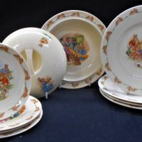 Group of Royal Doulton Bunnykins plates saucers and Covered bowl with warmer - Sold for $37 - 2019