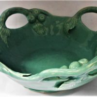 Vintage Australian pottery in the style of Harvey School fruit bowl with applied leaf and gumnut decoration and 'DIP No163' inscribed to base, approx  - Sold for $37 - 2019