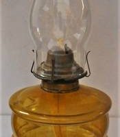 c1910 Oil lamp with cast iron base & amber glass bowl - 54cmH - Sold for $50 - 2019
