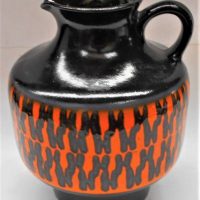 Mid-Century Modern West German pottery black and orange handled jug 17125 marked to base - approx 25cm tall - Sold for $43 - 2019