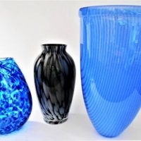 Group lot inc, 2 x unsigned Australian Studio Art Glass vases inc, flared blue form with vertical stripes and a clear teardrop form with light and dar - Sold for $50 - 2019