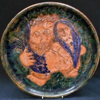 Robert Langley - Australian Terracotta Pottery charger with incised decoration of a 'Neptune with his Mermaid' 35cm diameter signed but illegible in i - Sold for $397 - 2019