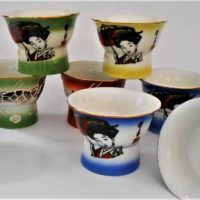 Set of 9 Japanese Saki cups with naked lady bases - Sold for $62 - 2019