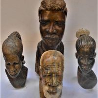 4 carved African busts in Wood and soapstone - Sold for $35 - 2019